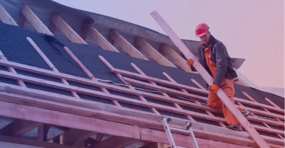 roofer carrying wood for roof construction osage beach mo